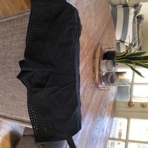 Size 8 Black Lululemon speed shorts with super cute pattern along bottom